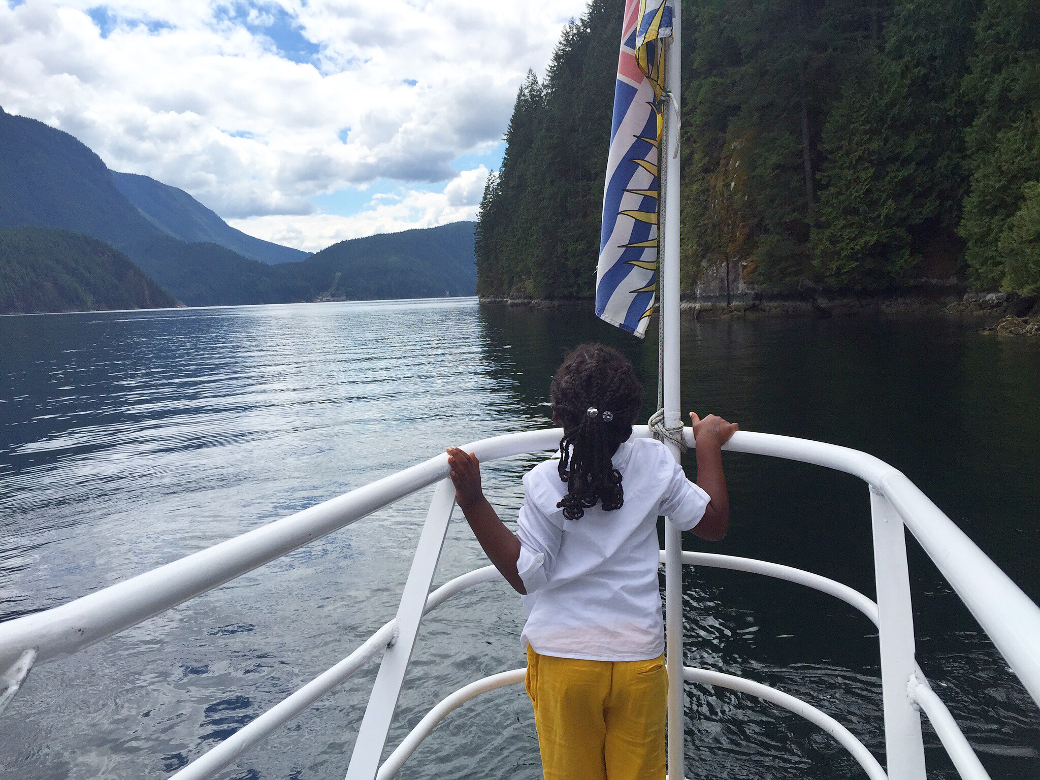 a girl standing on a boat