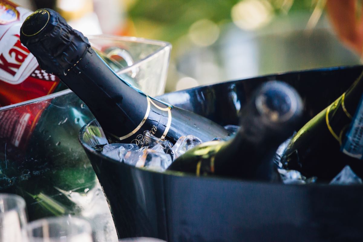 a bottle of champagne in a bucket of ice