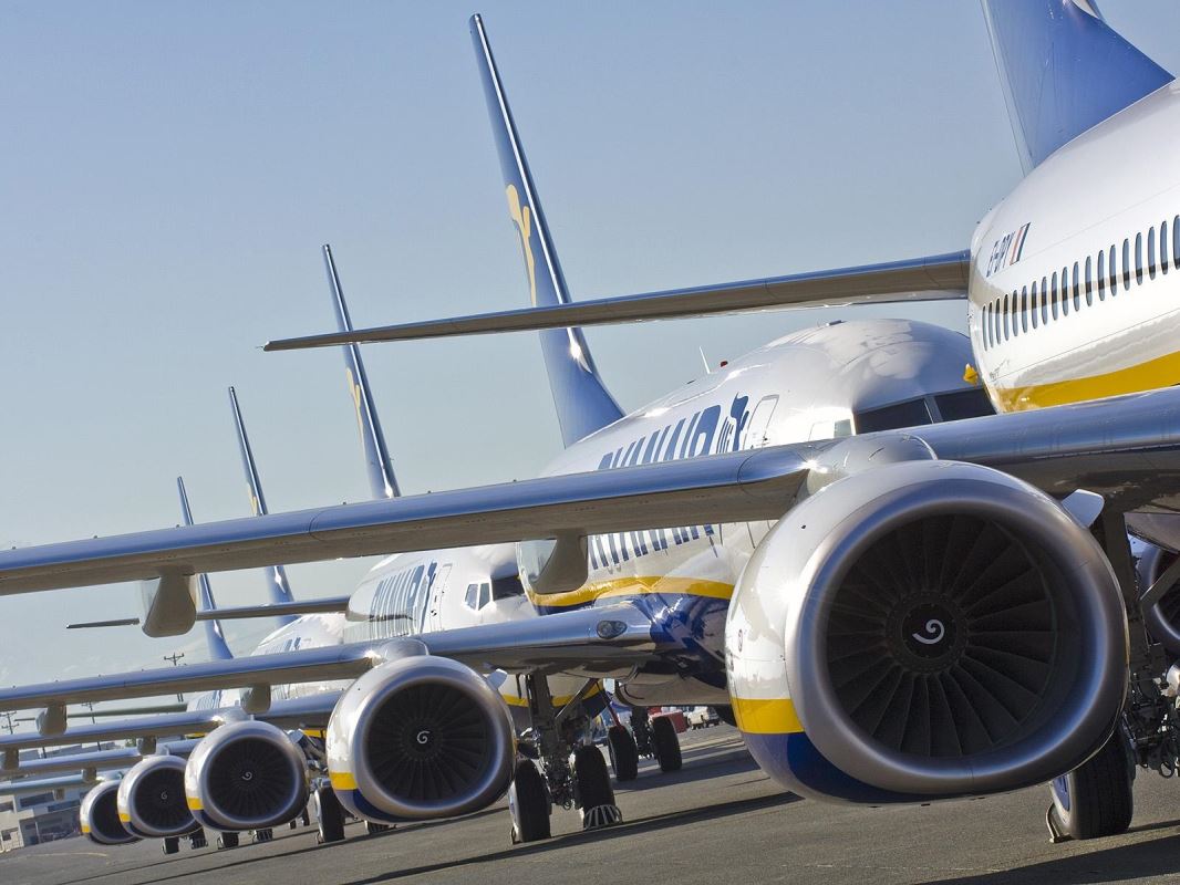 a group of airplanes parked on a runway