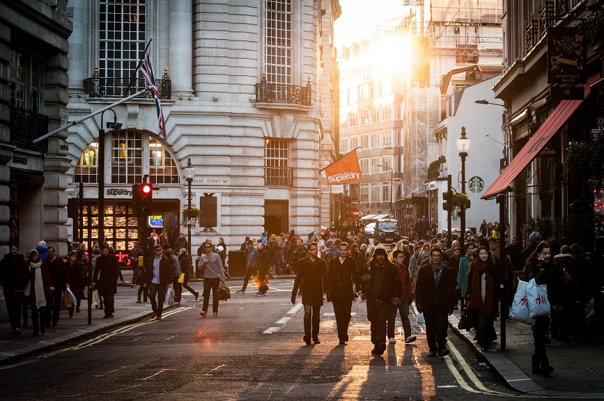 a group of people walking on a street