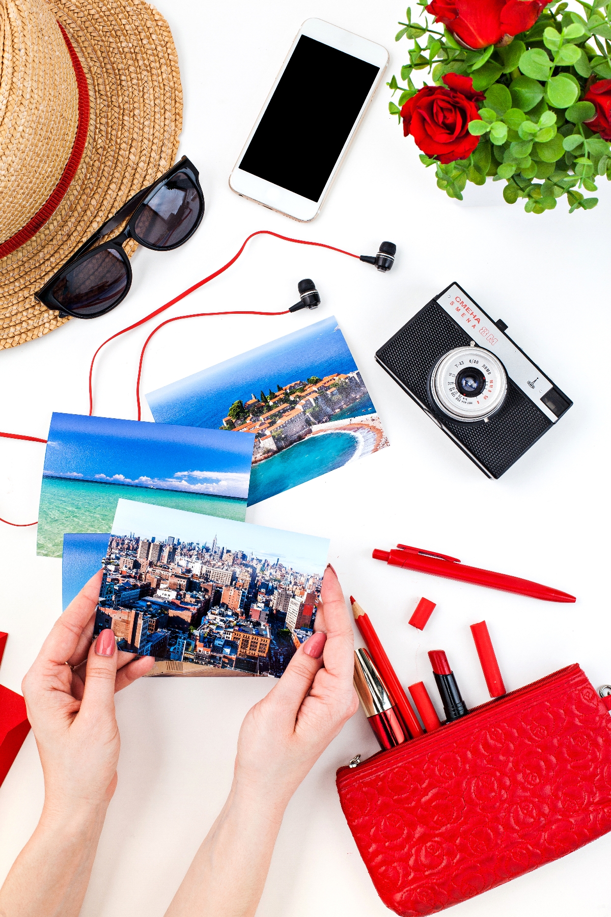 a person holding pictures next to a camera and a camera