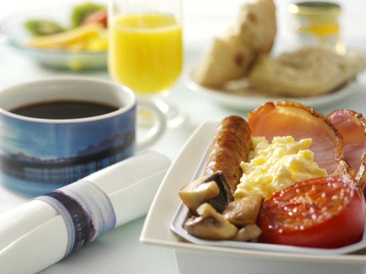 a plate of food and a cup of coffee