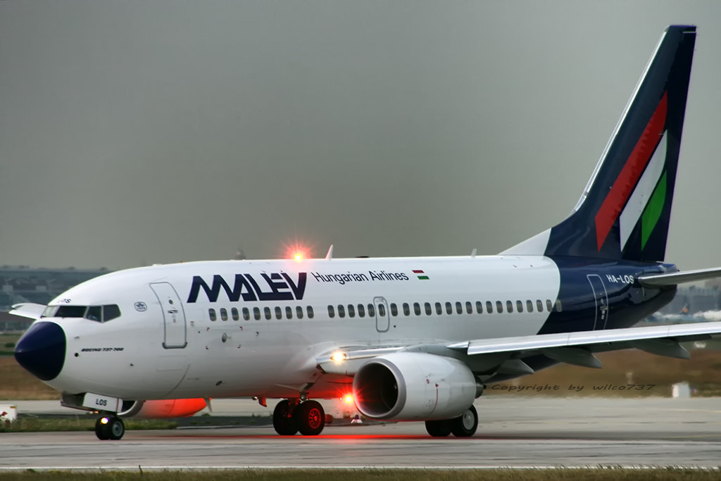 a white airplane on a runway