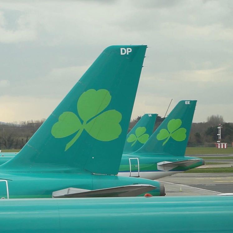 a group of green airplanes with four leaf clovers on them