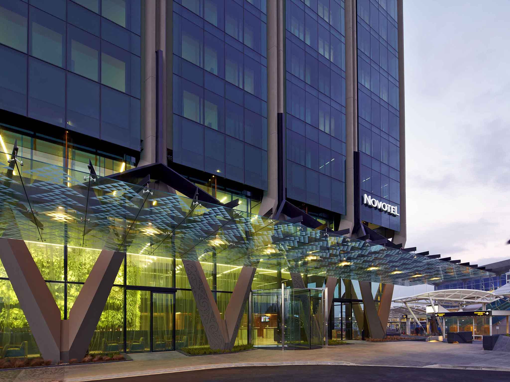 a glass covered entrance to a hotel