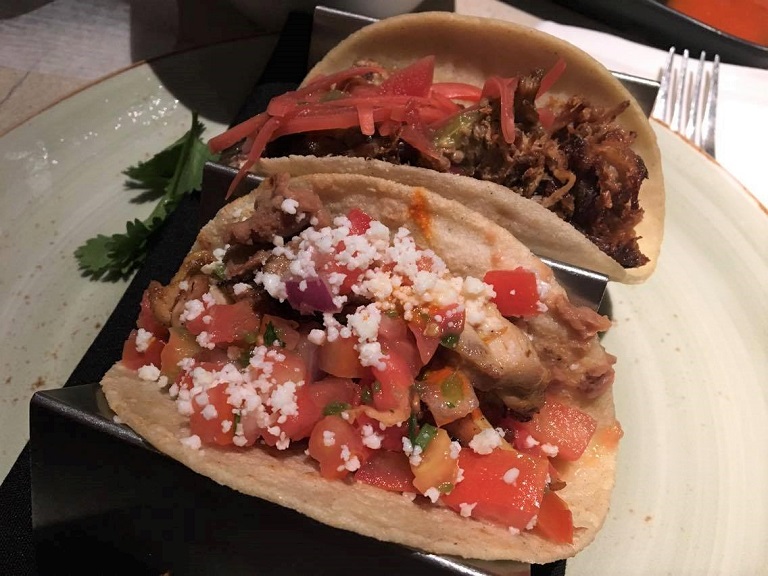 a plate of tacos on a table