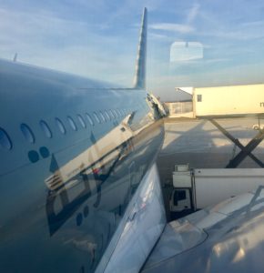 a plane with windows and a blue sky