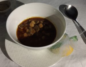 a bowl of soup with a spoon