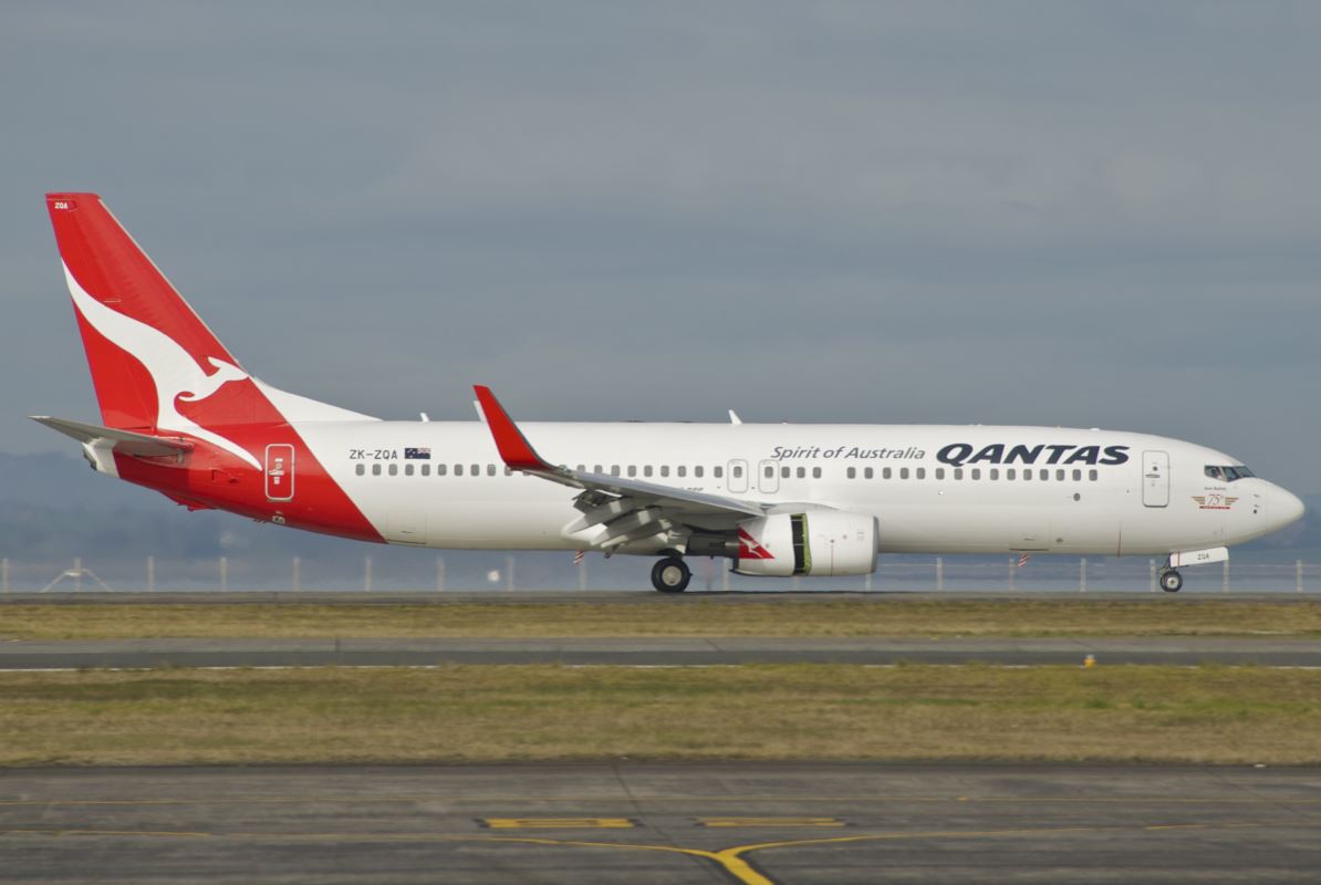 a white and red airplane on a runway