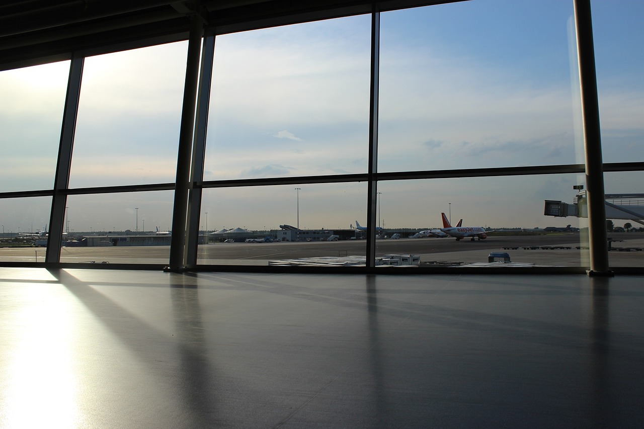 a large window with a lot of airplanes in the background