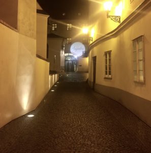 a dark alley way with lights