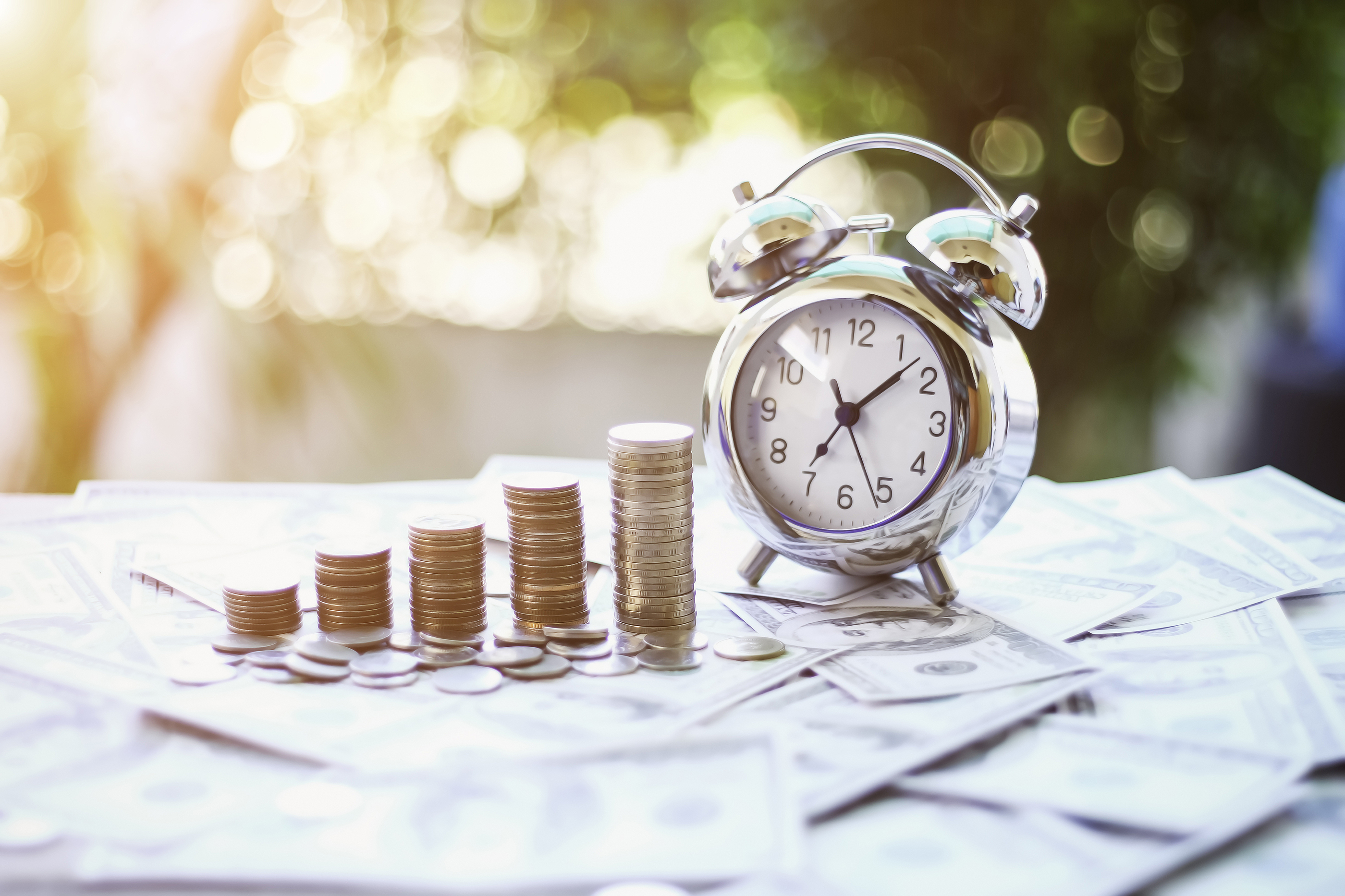 a clock and stacks of coins