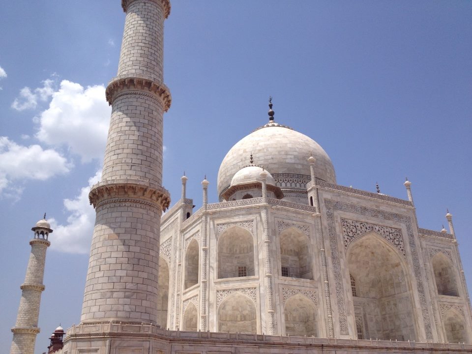 a white building with a dome and a tall tower