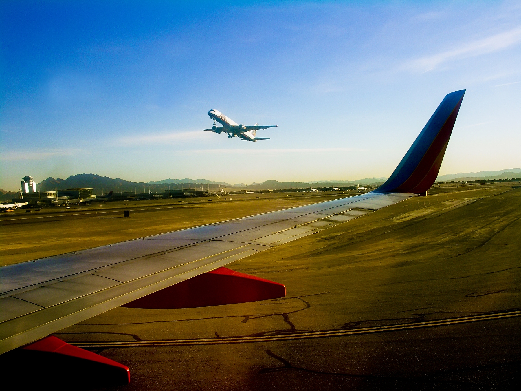 an airplane flying over an airport