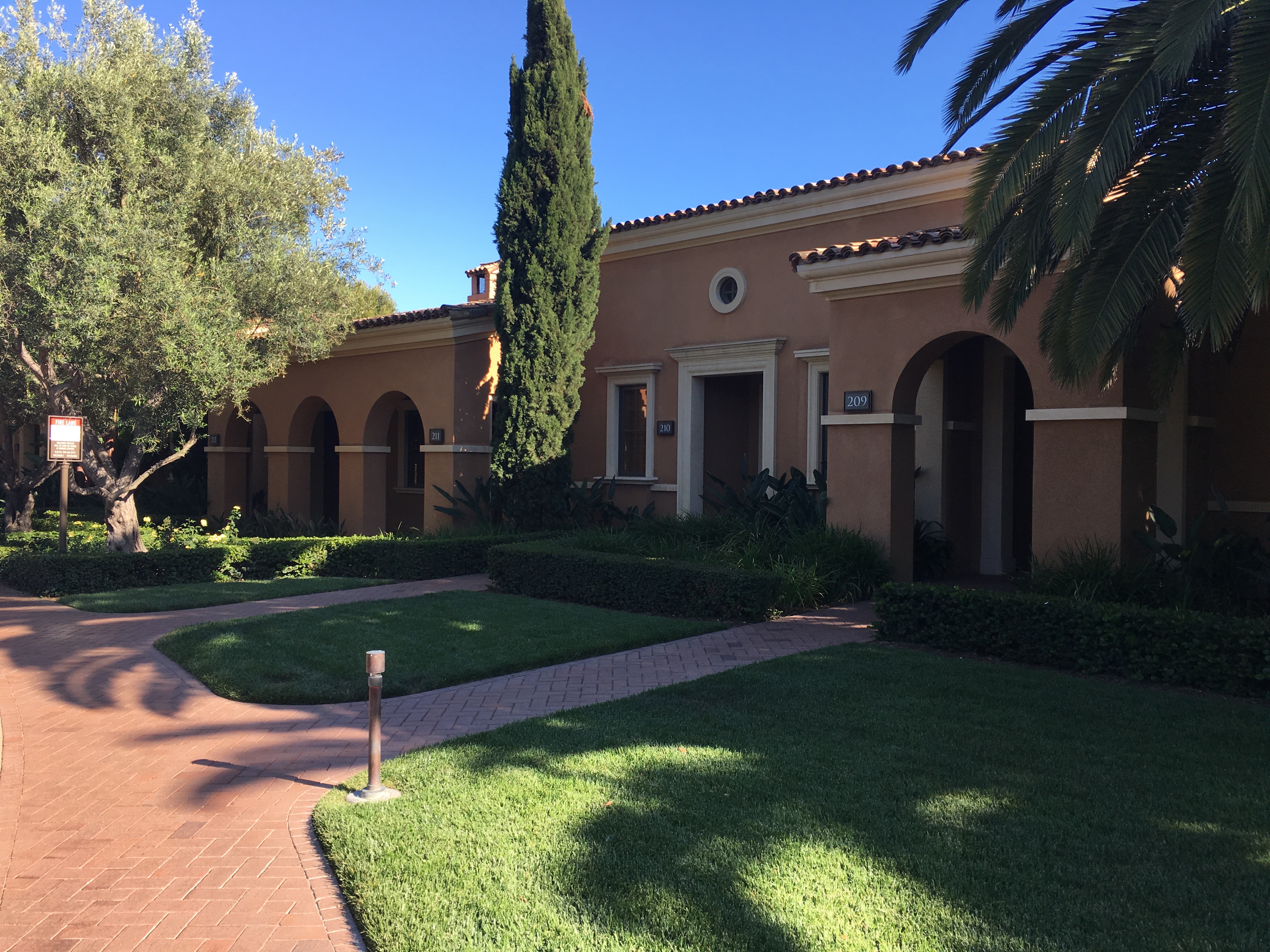 a building with a lawn and trees