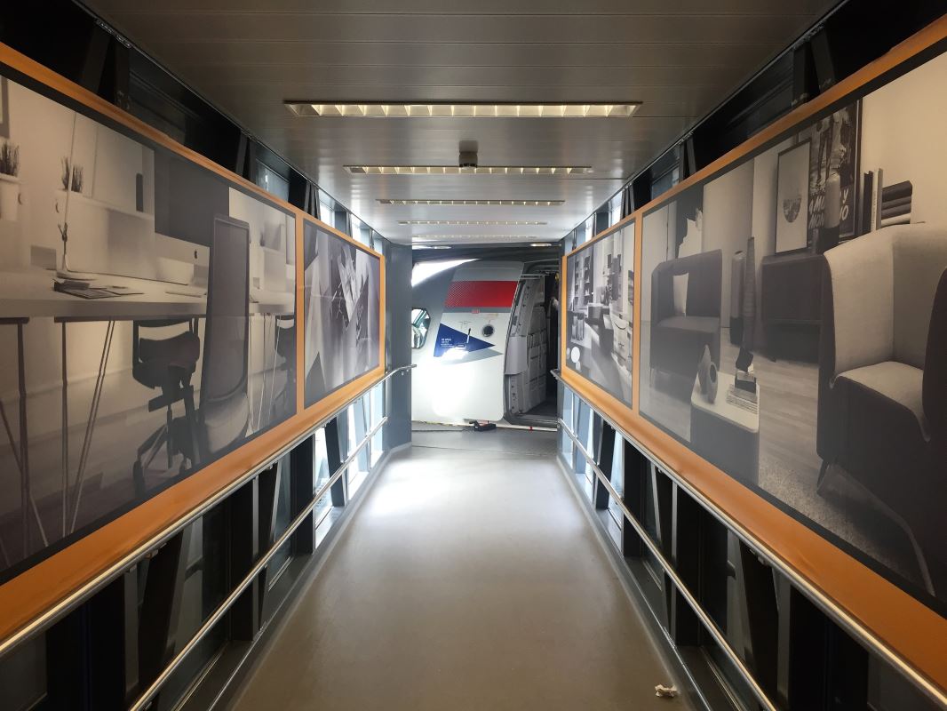 a hallway with pictures on the wall