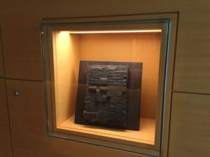 a display case with a piece of art