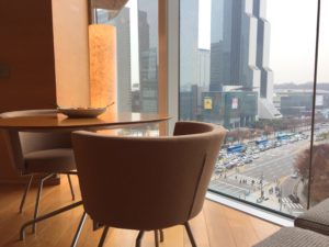 a chair and table with a view of a city