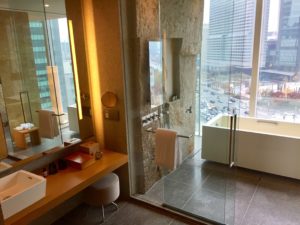 a bathroom with a bathtub and a tub