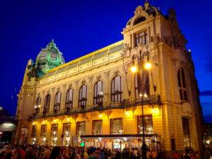 a building with many windows and a dome on the top