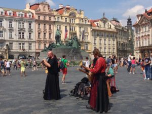 people playing instruments in a city