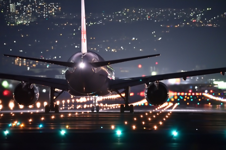 an airplane on a runway at night