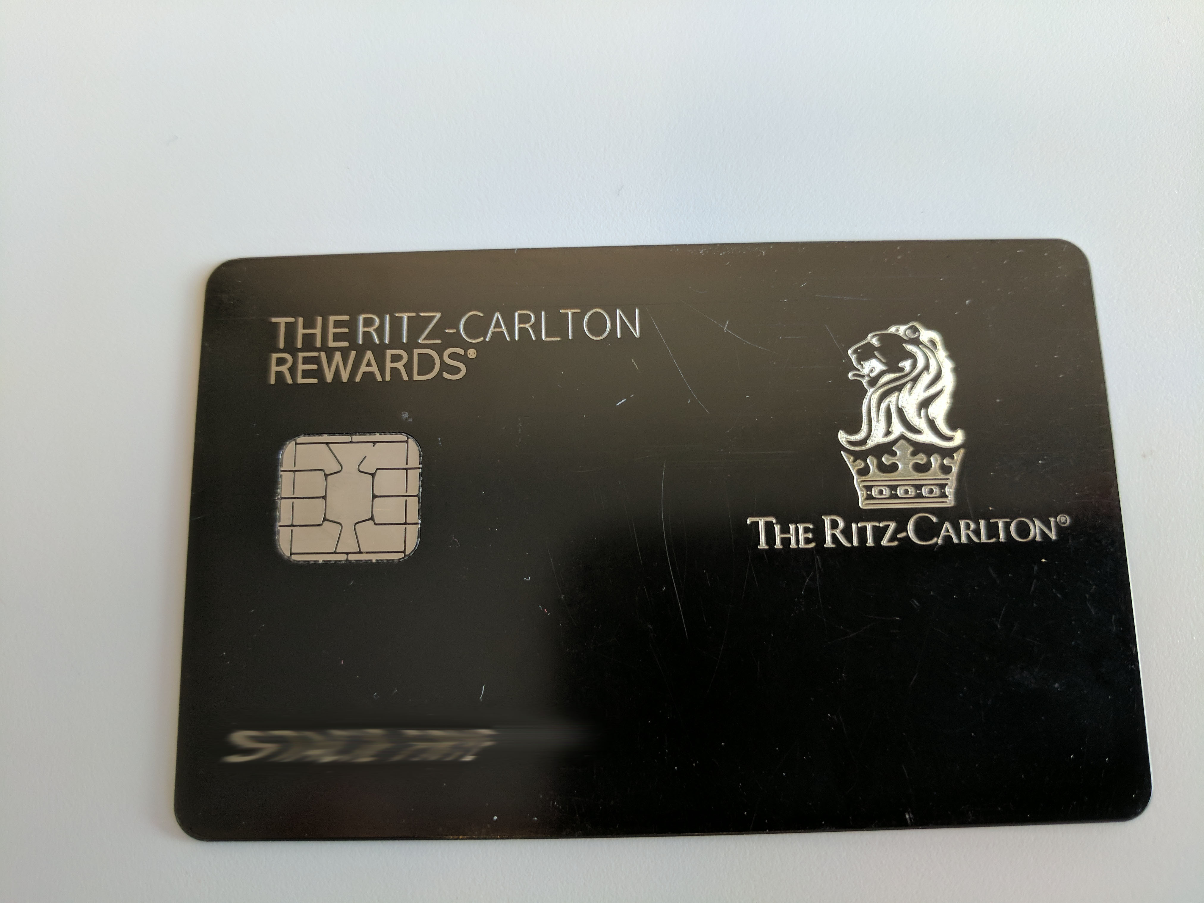 a black credit card with a chip