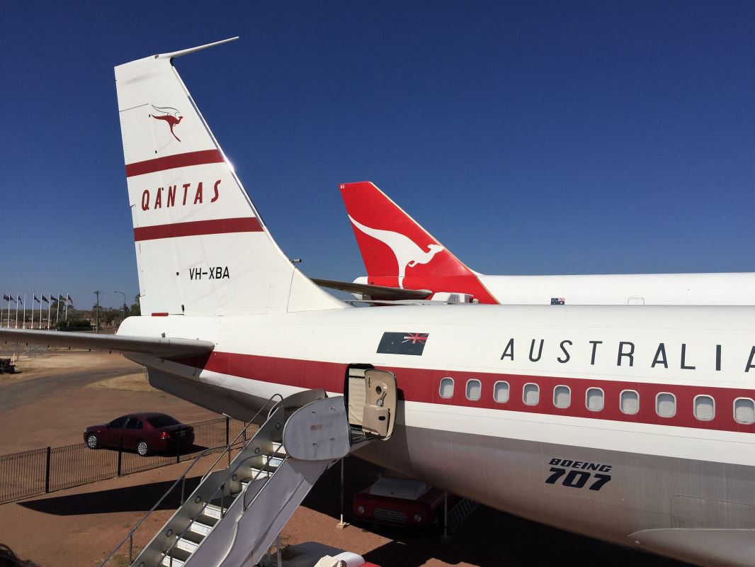 a plane with red tail fin