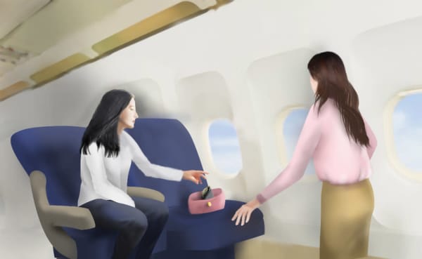 a woman sitting in an airplane with another woman in her lap