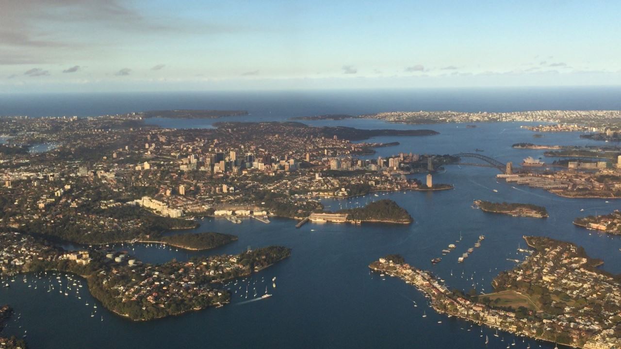 an aerial view of a city and water