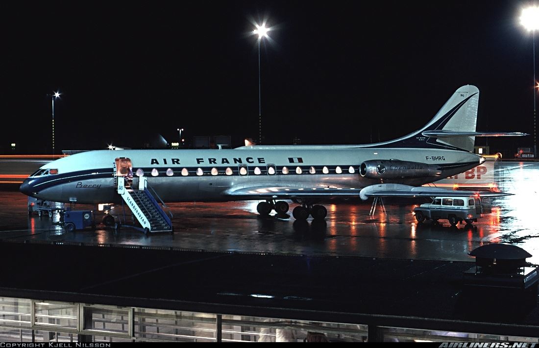 a plane on the tarmac at night