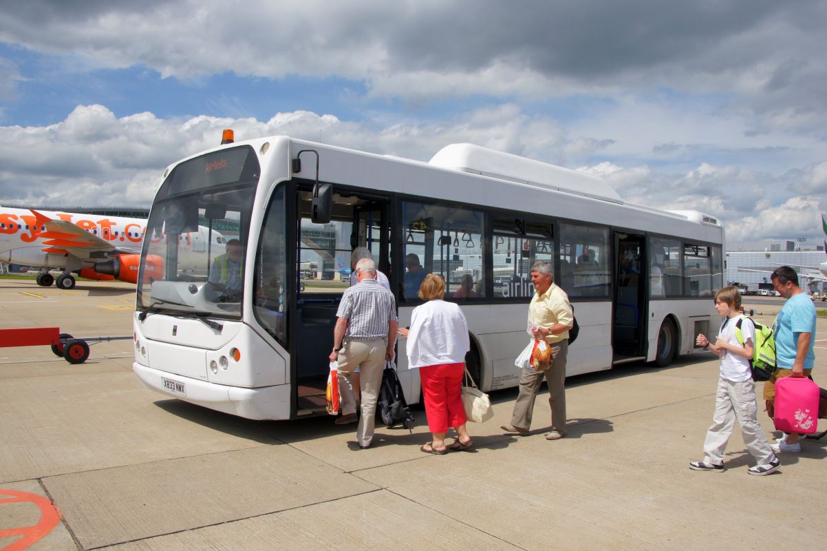 people getting on a bus