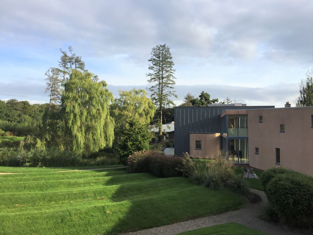 a house with a lawn and trees