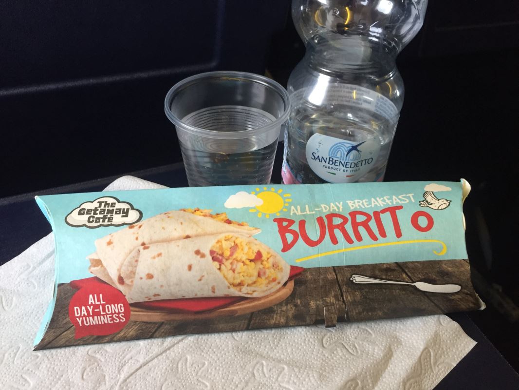 a burrito and two plastic cups