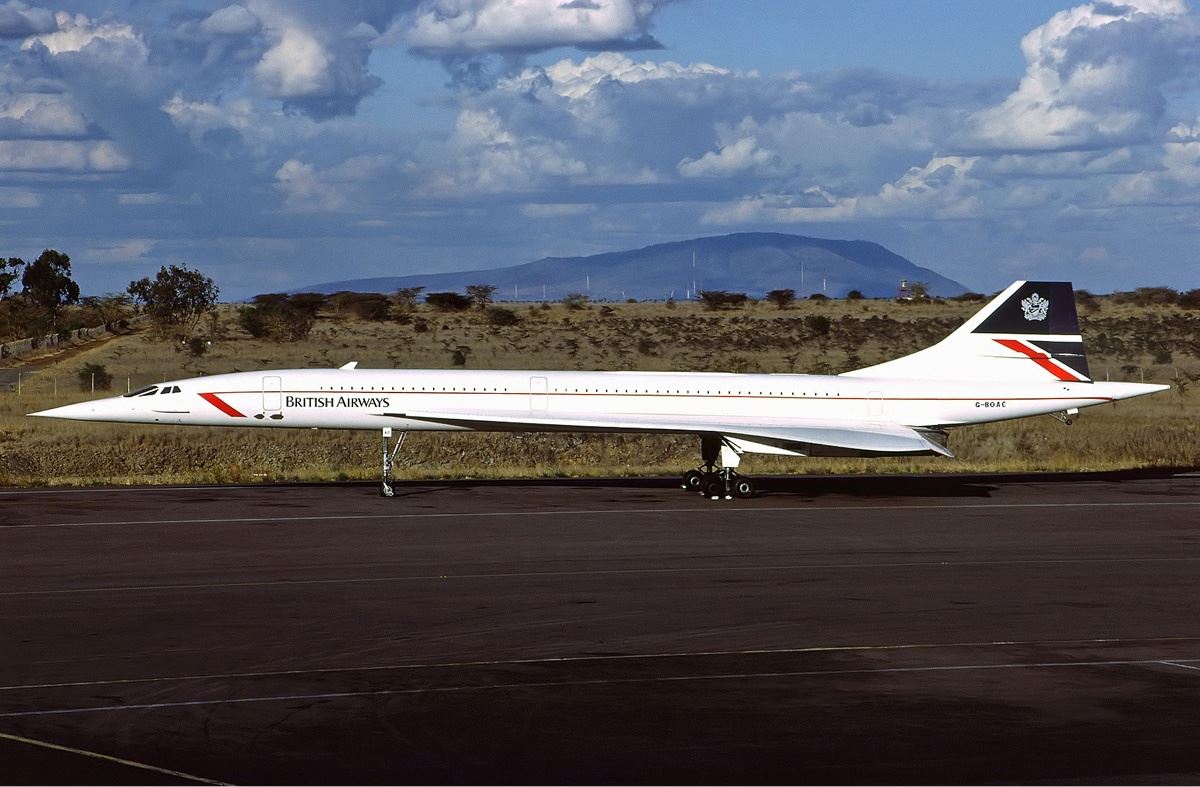 a white airplane on a runway