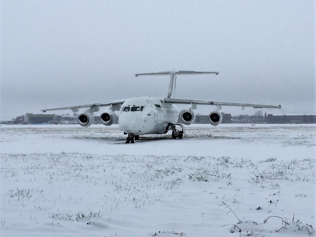 an airplane on a snowy field