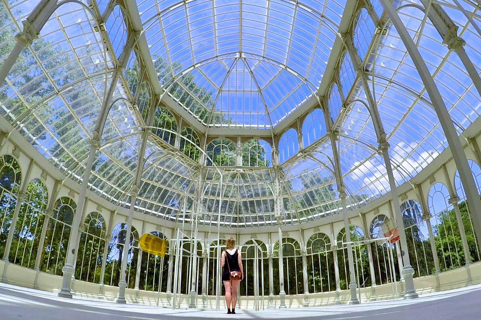 a woman standing in a glass room
