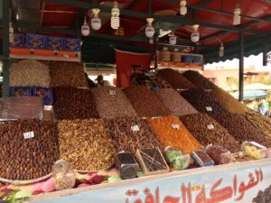 a market stall full of different kinds of nuts