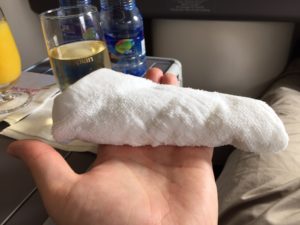 a hand holding a towel