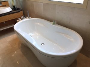 a white bathtub in a bathroom