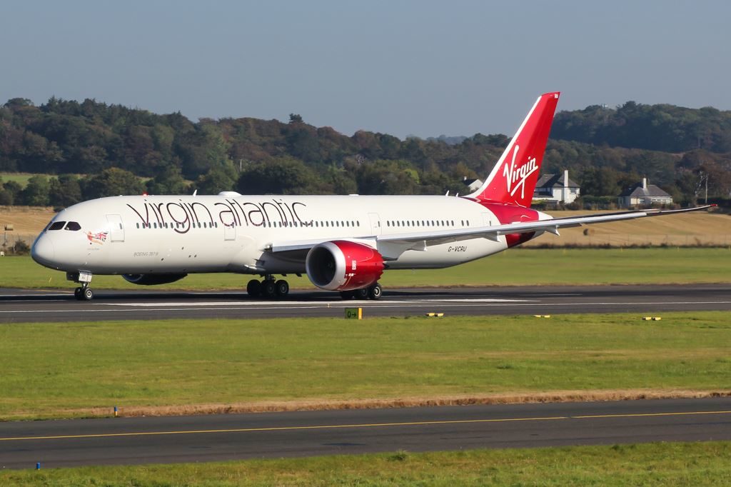 a white and red airplane on a runway