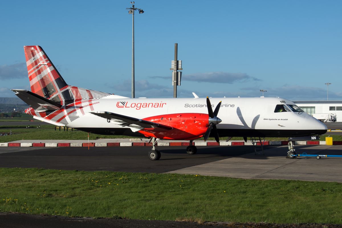 a white and red airplane on a runway