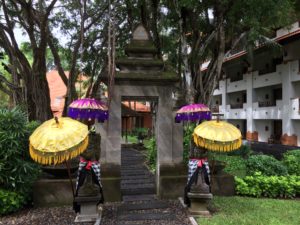 a group of statues with umbrellas