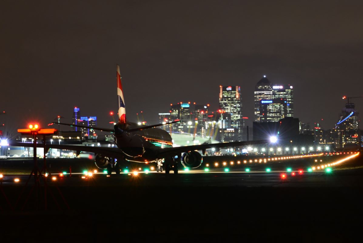 an airplane on the runway at night