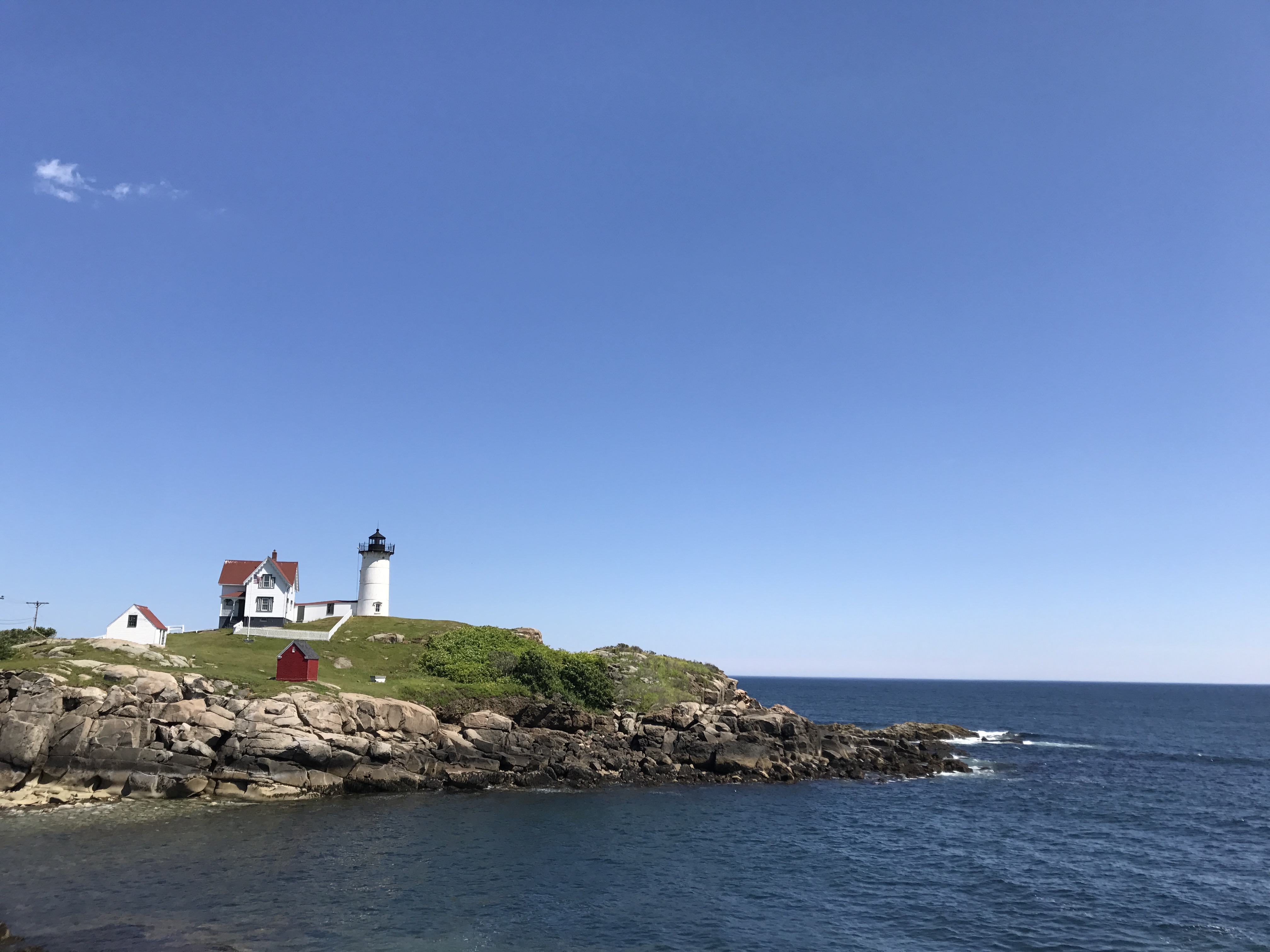 a lighthouse on a rocky island