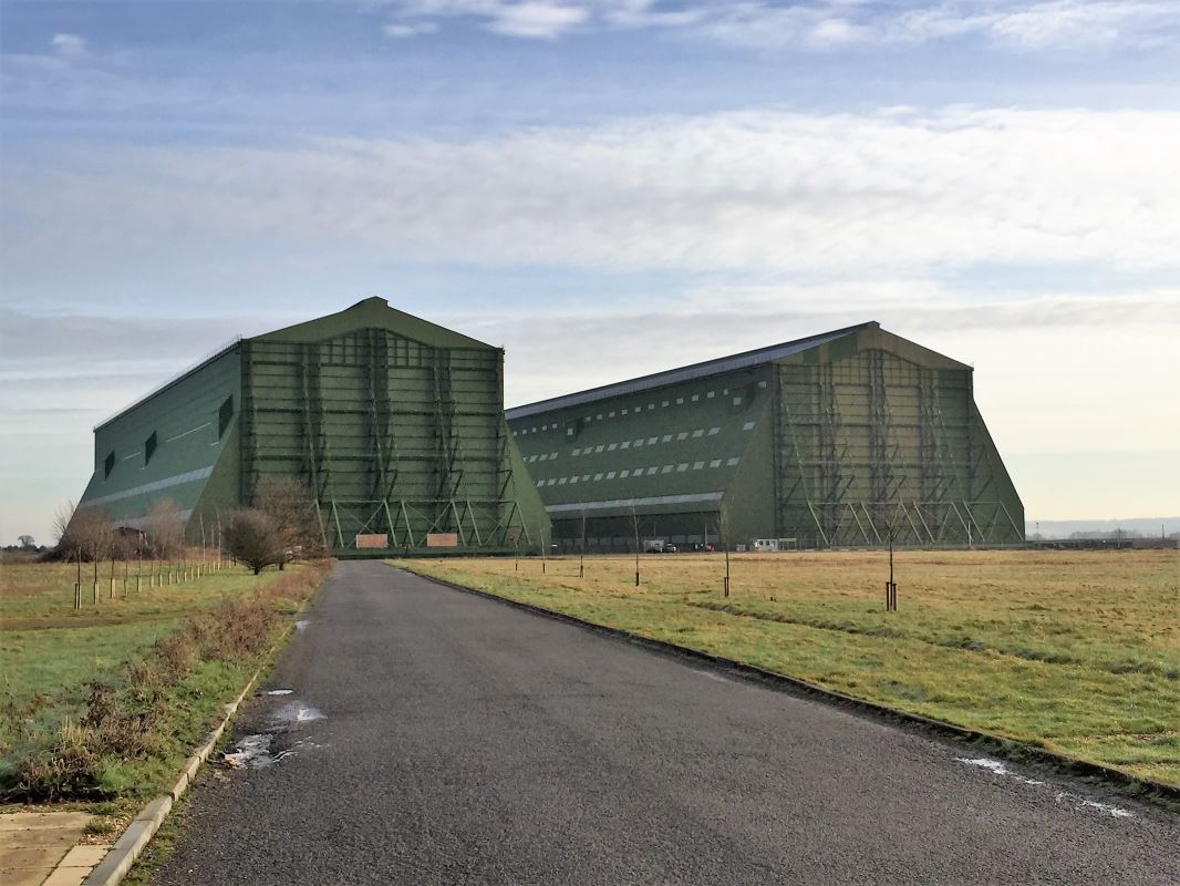 a two large buildings in a field