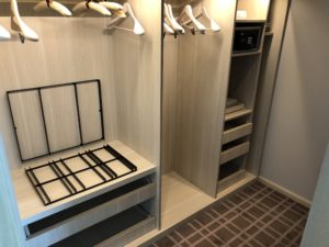 a closet with shelves and swingers