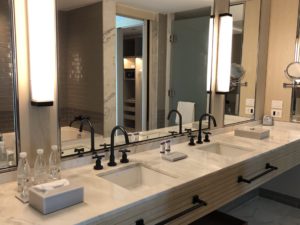 a bathroom with sinks and mirrors