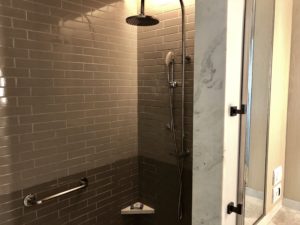 a shower with a light fixture