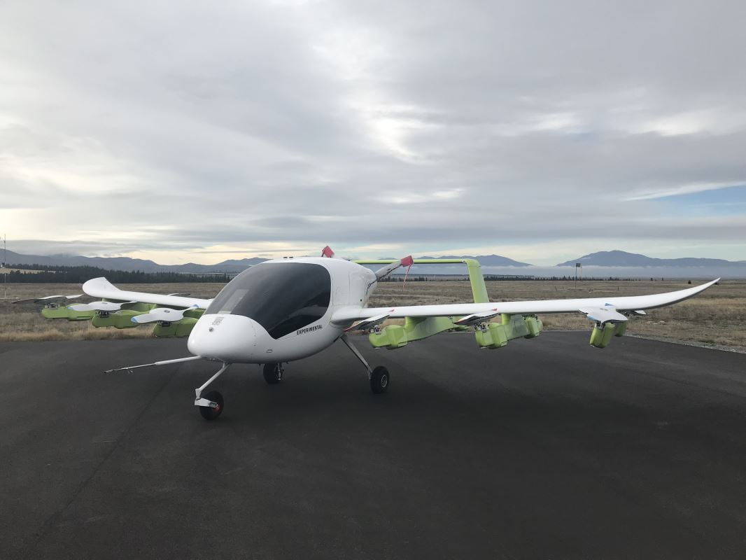 a white airplane on a runway